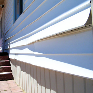 Damaged siding that needs to be replaced.