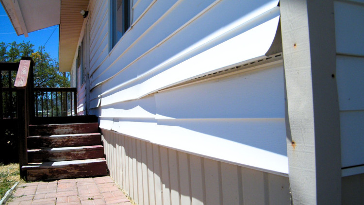 Damaged siding that needs to be replaced.