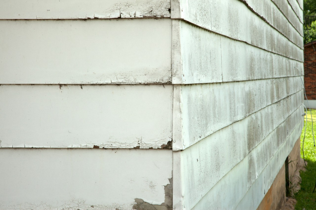 water damage behind siding on home