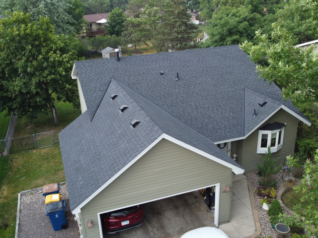 Shakopee home with newly installed roof replacement by Iron River