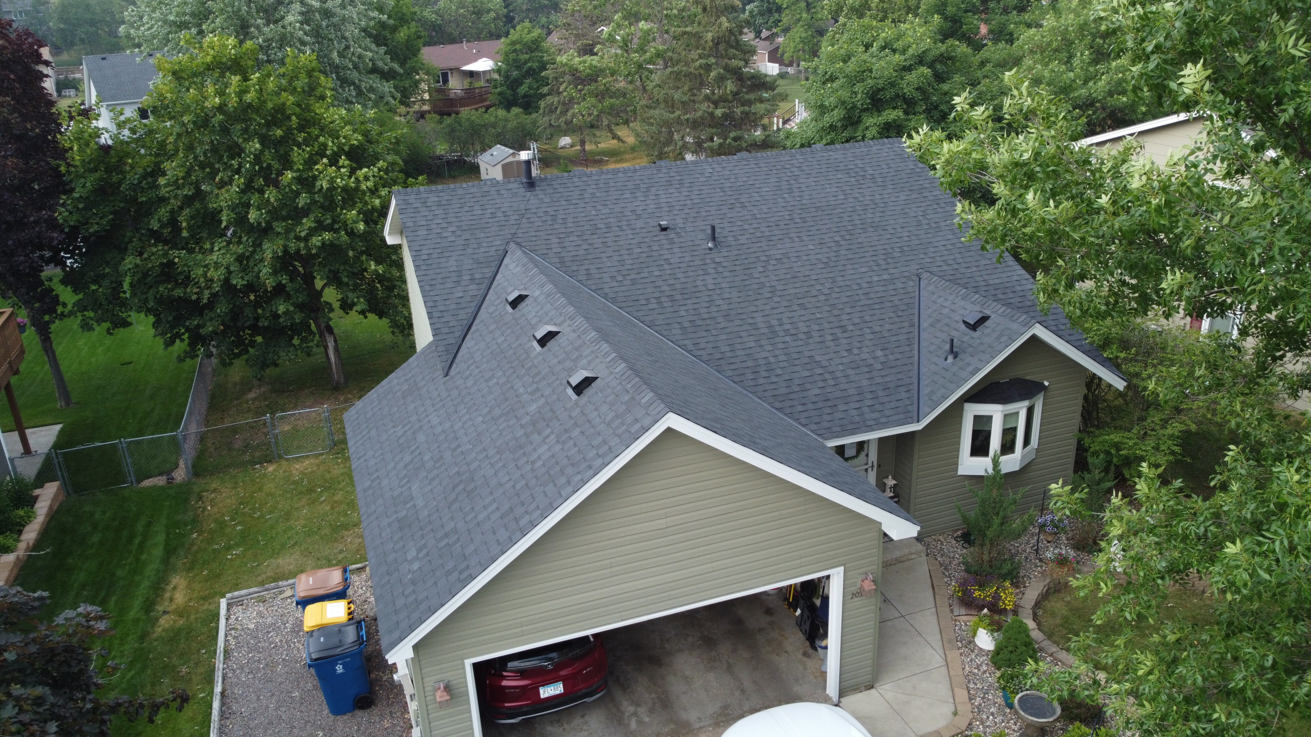 Shakopee home with newly installed roof replacement by Iron River