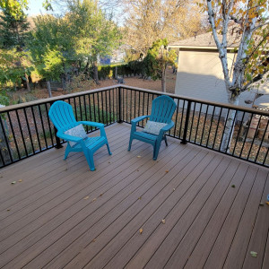 Beautiful deck added to a home by Iron River.