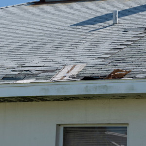Storm damaged roof in need of inspection.